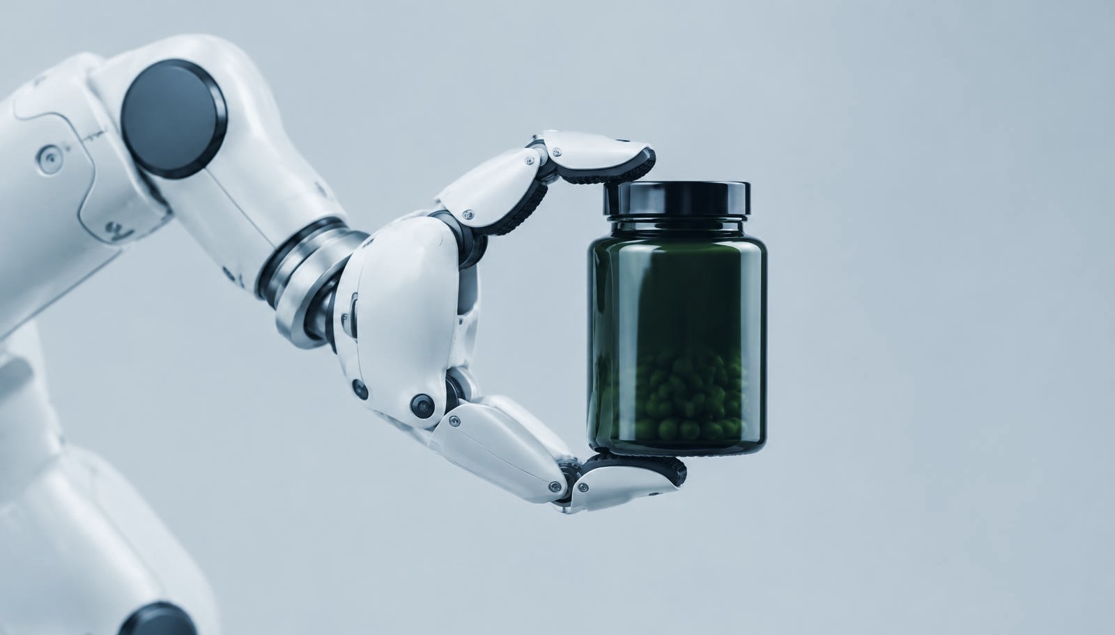 Robotic lab arm holding a supplement jar